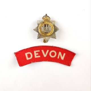 Devonshire Regiment – Printed Shoulder Title And Cap Badge